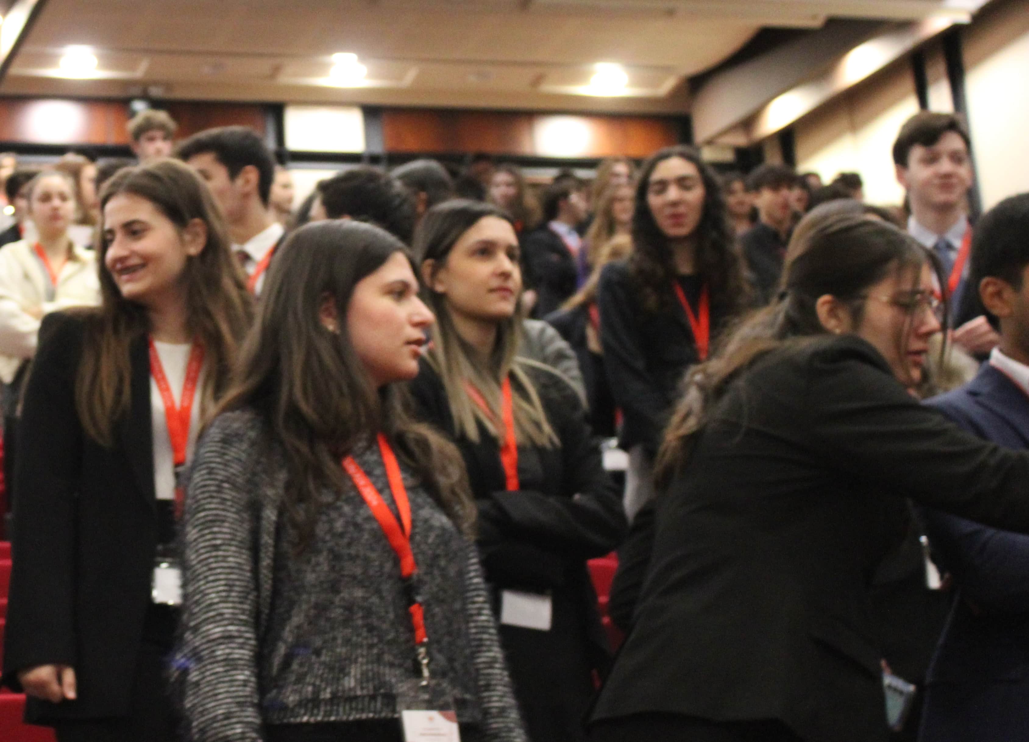 Delegates standing up at the end of the plenary session.